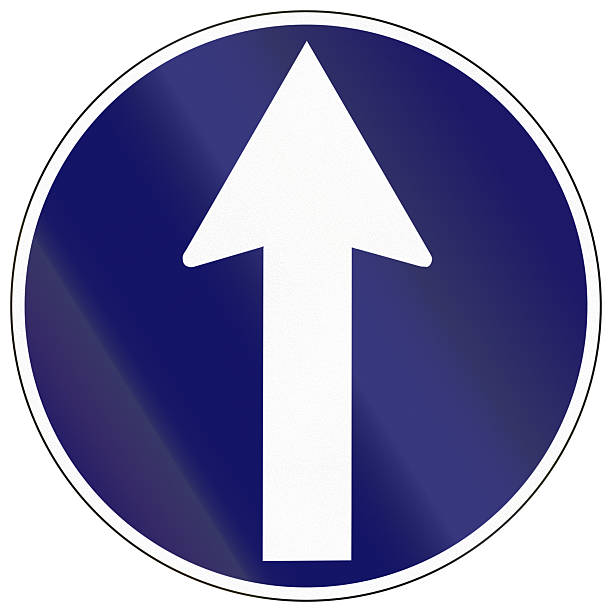 istock Regulatory road sign in Cambodia - Straight through only 2223913162