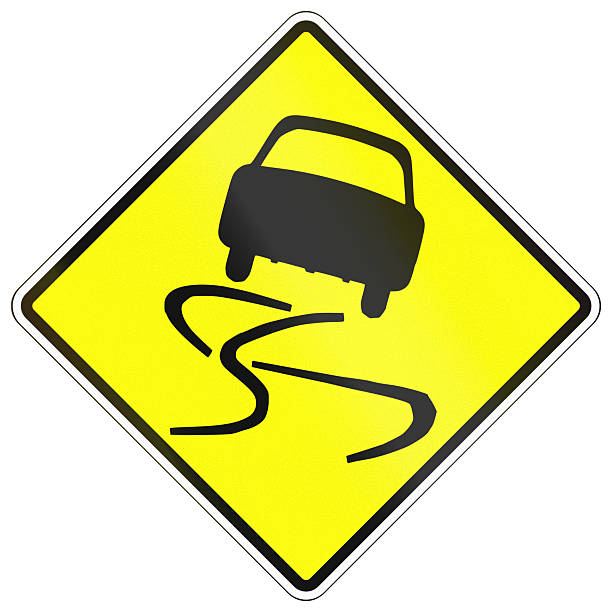 istock Warning road sign in Cambodia - Slippery road 2223913216