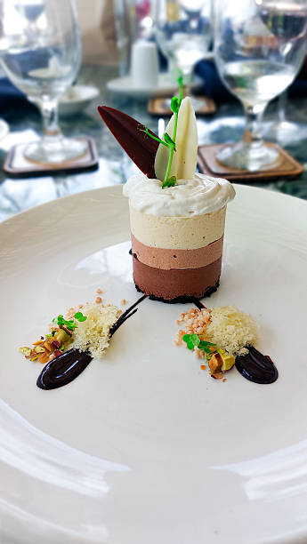 A sophisticated dessert featuring layered mousse