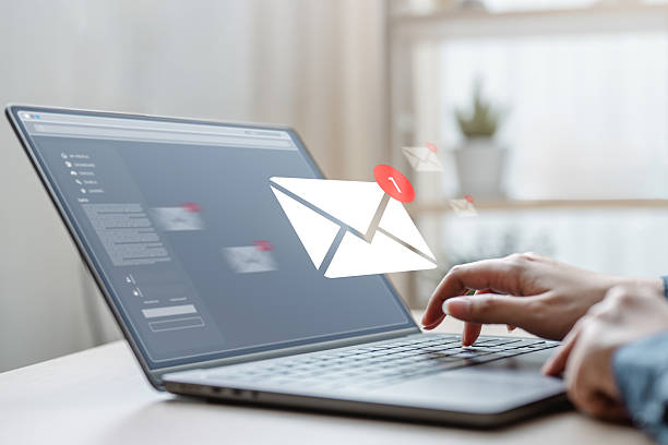istock Email marketing concept. Mail newsletter send. Receive envelope email. Message contact reminder. Technology marketing. A person is using a laptop to send an email. The laptop is on a table. 2223914721