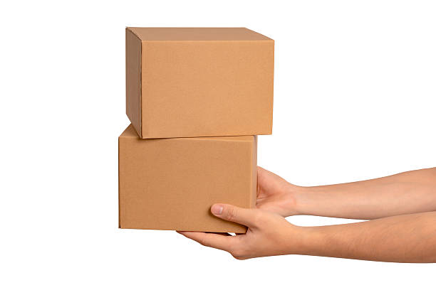 istock Hand holding parcel box isolated on white background. Concept for transportation and delivery. 2223917551