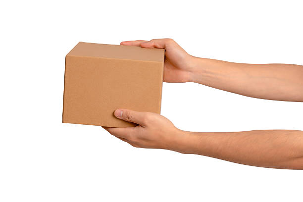 istock Hand holding parcel box isolated on white background. Concept for transportation and delivery. 2223917556
