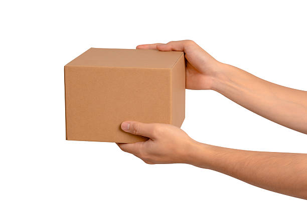 istock Hand holding parcel box isolated on white background. Concept for transportation and delivery. 2223917562