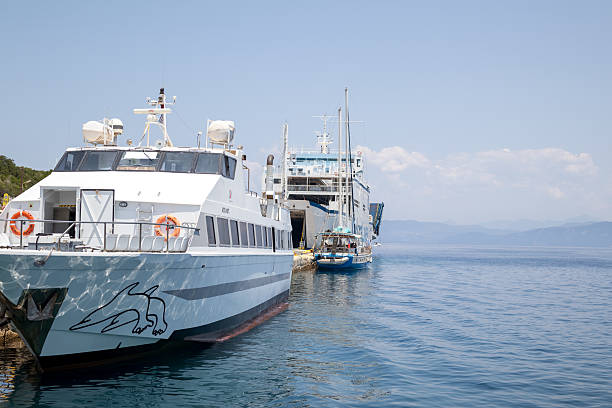 Antipaxos, Greece, jun 18, 2025. Ferries and Boats Docked in a Calm Blue Mediterranean Harbor
