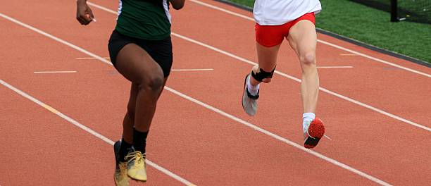 istock Runners Competing on a Track During a School Athletics Event 2223921138