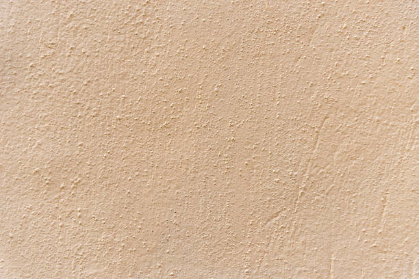 Light texture of a wall. Grainy and rough. Background for projects. Abstract