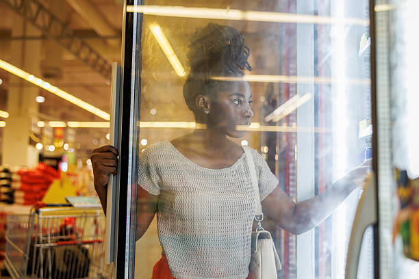 istock Woman Selecting Dairy Products From Fridge 2223923703