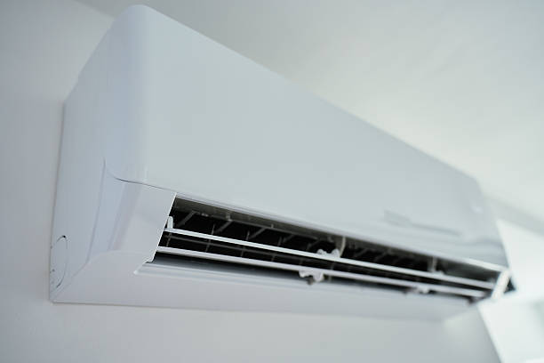 istock Modern wall mounted air conditioner unit in white room. Home climate control 2223924080