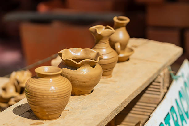Hands of a craftsman making ceramics using clay