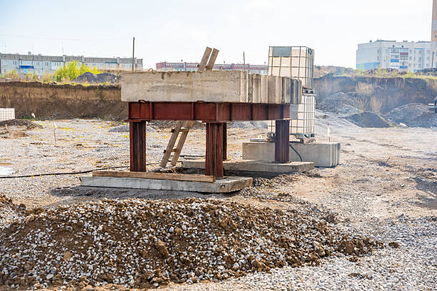 istock Plate load test in progress with heavy weight applying static pressure on soil. Geotechnical procedure to assess ground settlement and load-bearing capacity 2223929189