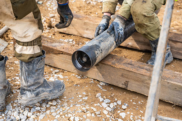 istock Opening of container with soil sample extracted from borehole. Preparation of core material for visual inspection and laboratory testing 2223929241