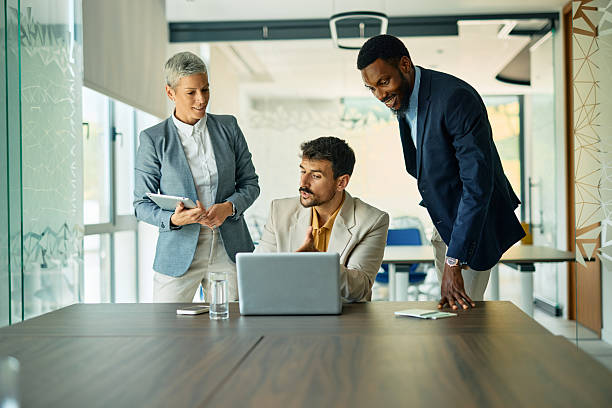 istock Business team working together on a laptop in modern office 2223934522