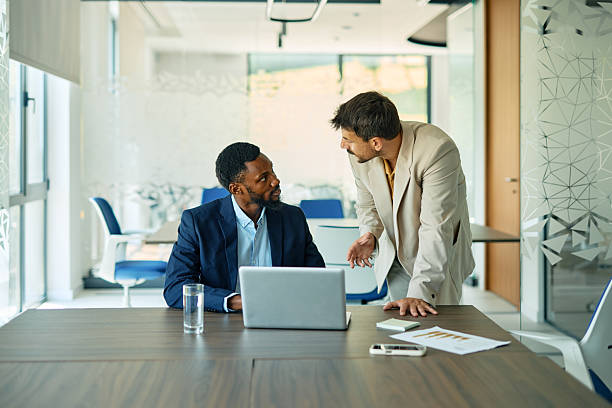 istock Two businessmen discussing work in the office 2223934581