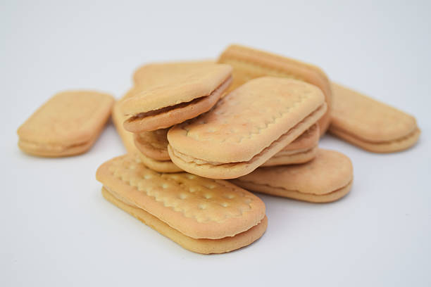 istock Stacked sandwich cookies against a white background. 2223937747