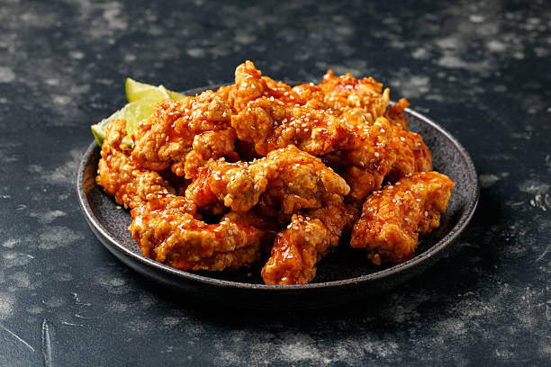 istock Korean fried chicken with spicy sauce and sesame seeds 2223941856