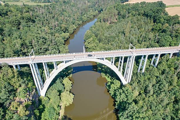 istock Bechyne Bridge or Bechyne Rainbow, rarely Rainbow Bridge is a unique reinforced concrete arch bridge over the river Luznice. Aerial view to monument in Czech Republic, Central Europe,for cars,trains 2223943907