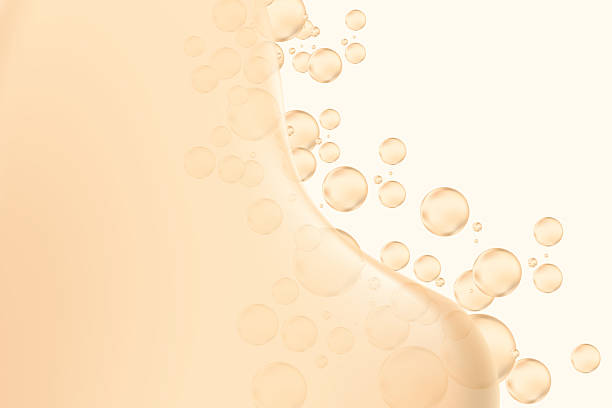 istock Abstract nude beige liquid lotion or serum background with copy space. Fluid bubbles or droplet flow, fluid collagen texture wallpaper. Beauty product presentation, cosmetic promotion, banner 2223944823