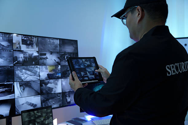 istock Security officers are checking the TV screen of the CCTV system. 2223949470