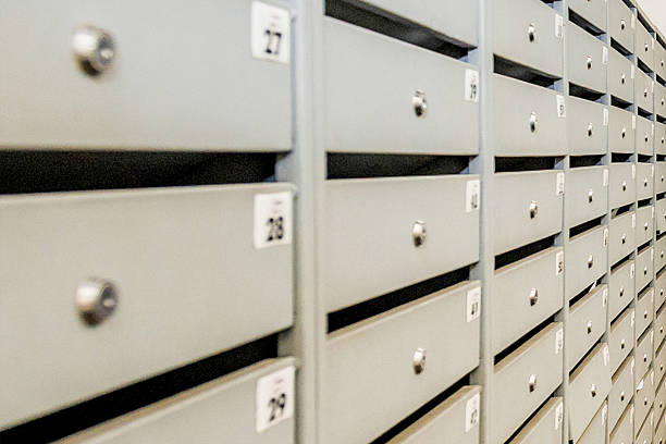 istock Ground floor with mailboxes in residential building, front door entrance 2223954021