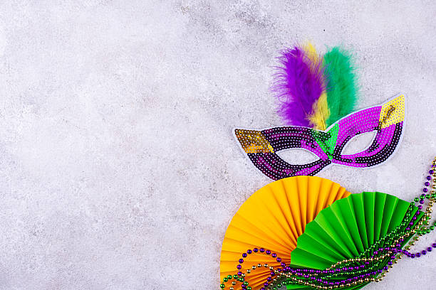 istock Vibrant Mardi Gras background with mask, beads, and festive decorations 2223955115