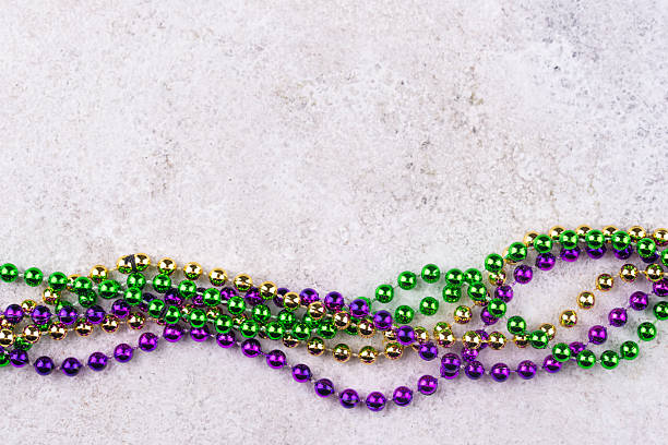 istock Vibrant Mardi Gras background with mask, beads, and festive decorations 2223955126
