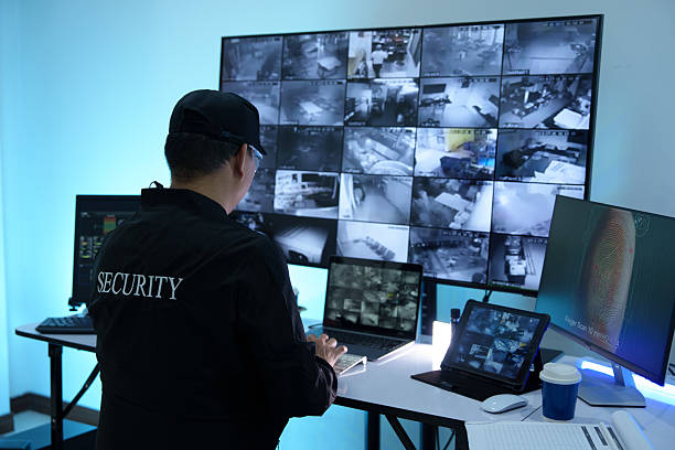istock Security officers are checking the TV screen of the CCTV system. 2223955644