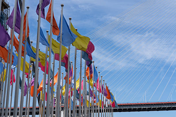 Colorful flags fluttering under the blue sky and white clouds