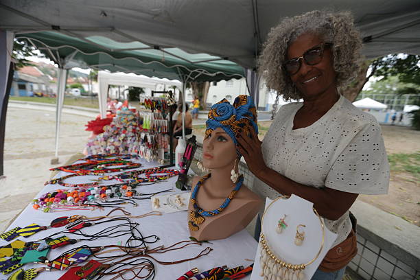 cachoeira, bahia, brazil - march 11, 2022: An artisan displays bags for sale at a street market in the city of Cachoeira in Bahia.