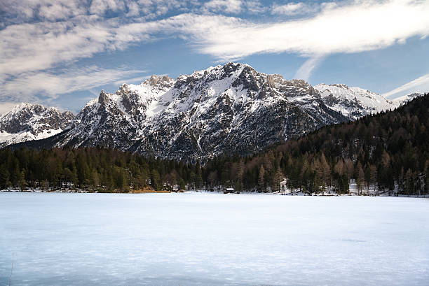 istock Frozen Mountain Lake with Snow-Capped Peaks and Winter Forest 2223964015
