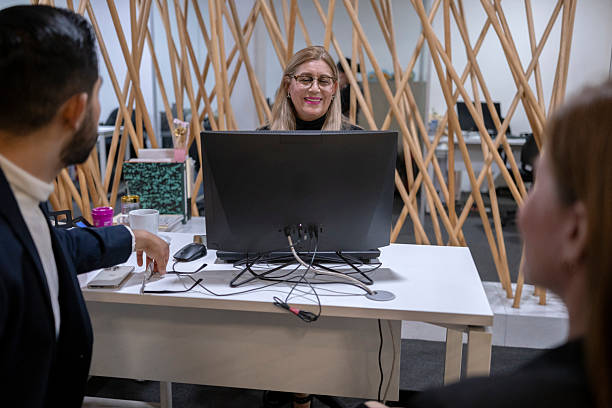 istock office colleagues discussing and chatting in a work environment 2223965497