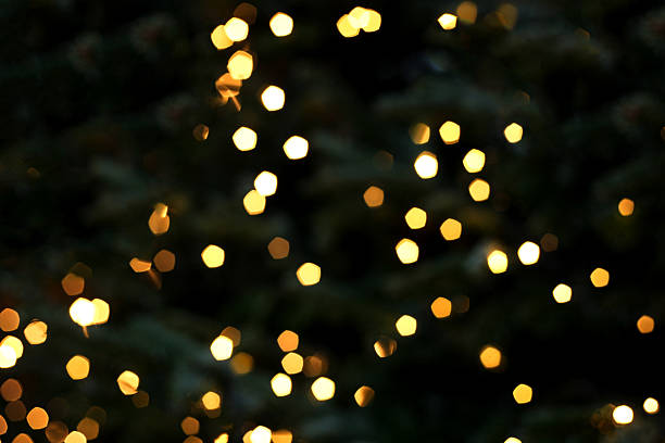 istock Festive holiday bokeh background from Christmas tree lights on dark background. 2223967463