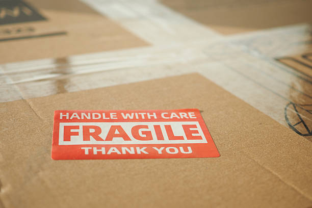 istock Box labeled fragile handled with care at a shipping facility 2223969186