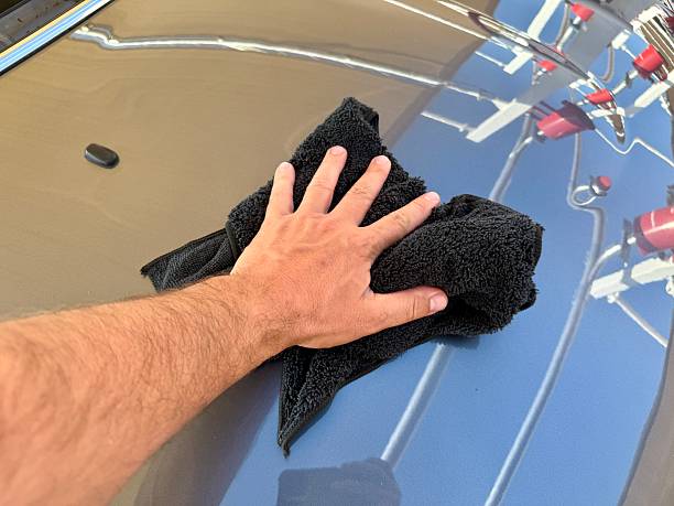 istock Man hand cleaning car with microfiber cloth at car wash 2223971837