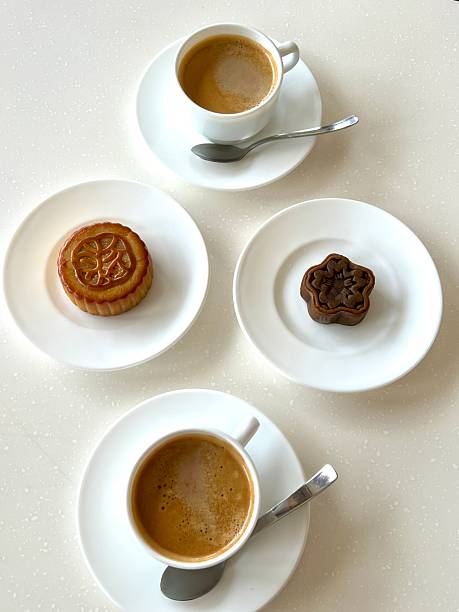 A delightful assortment of desserts displayed in a cozy cafe setting, featuring cakes, pastries, and sweet treats on elegant plates, creating a warm and inviting atmosphere.
