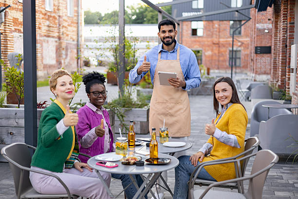 istock Friends Enjoying Outdoor Dining 2223974209