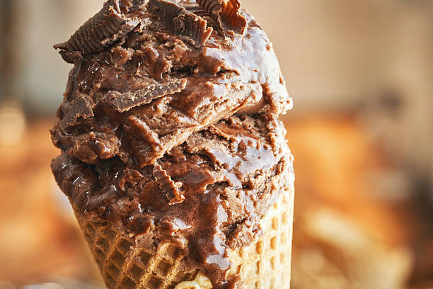 istock Chocolate Ice Cream with Chocolate Chips in a Cone 2223976560