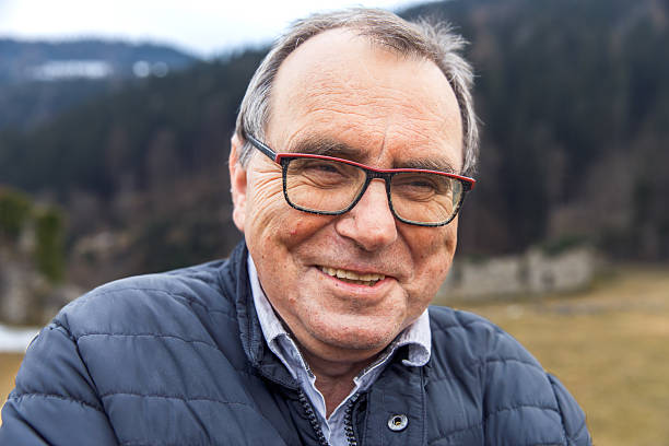 istock Elderly caucasian male smiling outdoors in a winter jacket 2223977391