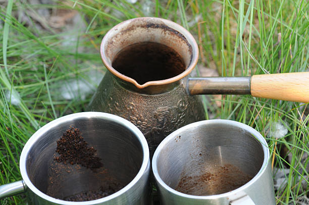 istock Coffee pot and cups on the grass in the garden. 2223981375