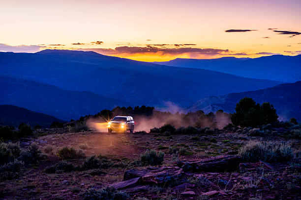 istock SUV Exploring Dirt Road at Dusk with Dramatic Mountain Views 2223982986