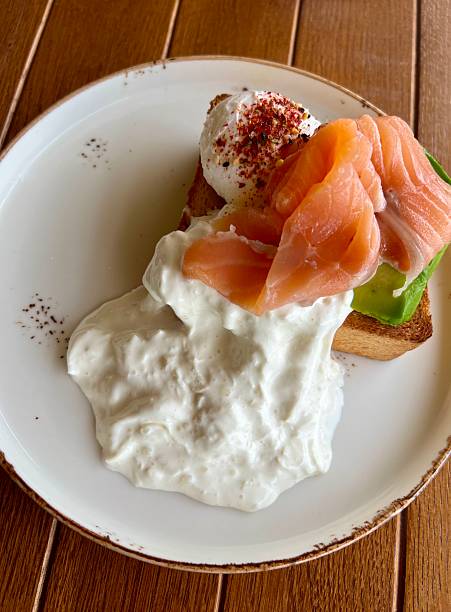 Brunch or breakfast plate: smoked salmon, poached egg, avocado on a toast