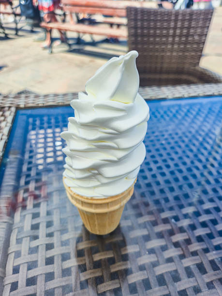 istock Ice cream cone on the table at summer time. 2223988420