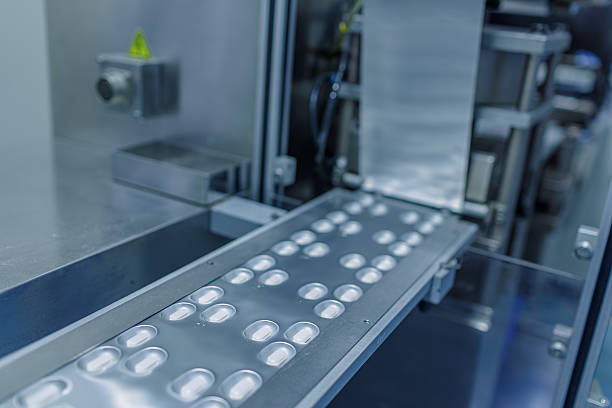 istock Automatic Tablet Blister Packaging Line in Modern Pharmaceutical Manufacturing Facility 2223988968