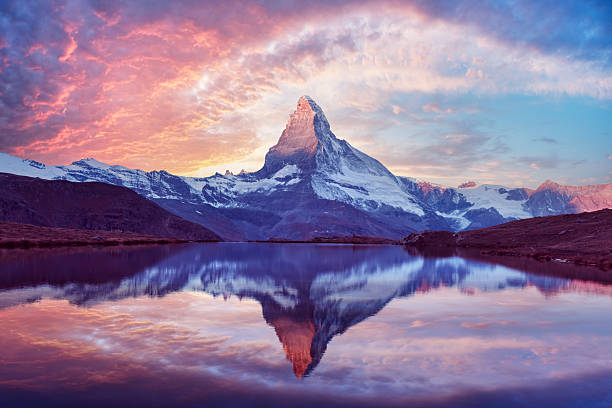 istock Stellisee lake glows at sunset with perfect Matterhorn reflection 2223992353
