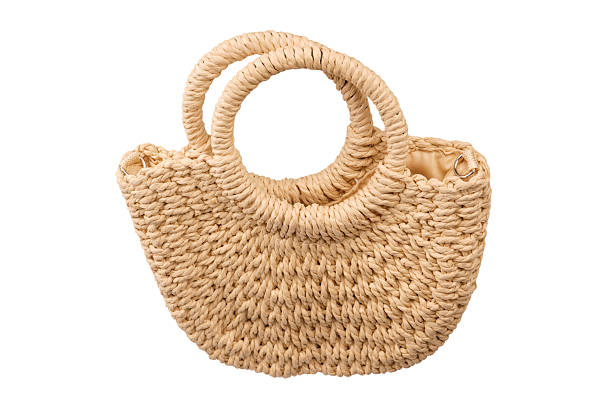 istock A beige straw bag isolated on a white background. 2223995194