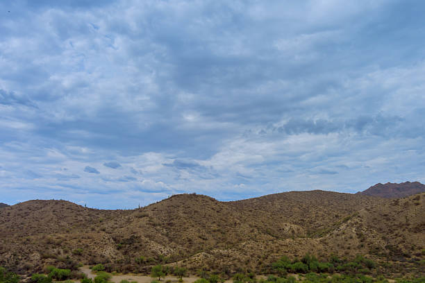 istock Rugged terrain near Beeline Highway. Arid hillsides under dramatic cloudy sky in Sunflower, Arizona. 2223995728