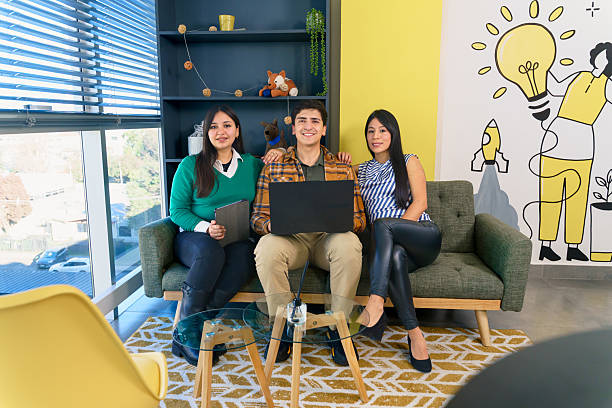 istock Coworkers smiling and working together on a project in a creative office space 2223995817