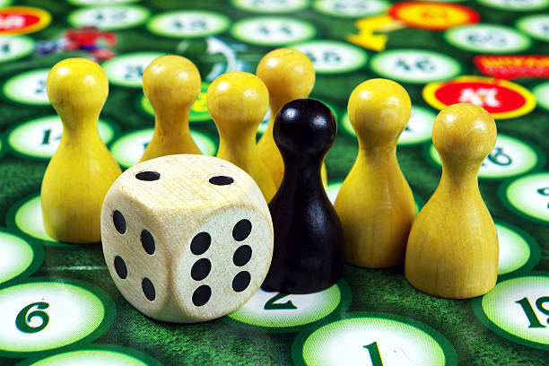 colorful play figures with dice on board