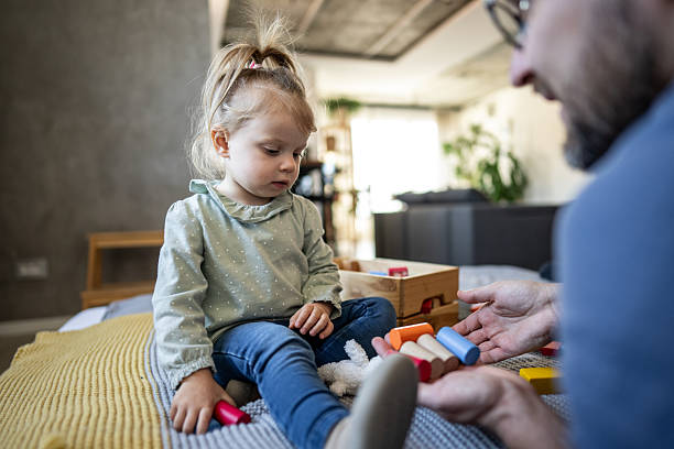 istock Father and daughter engaging in creative playtime 2224001923