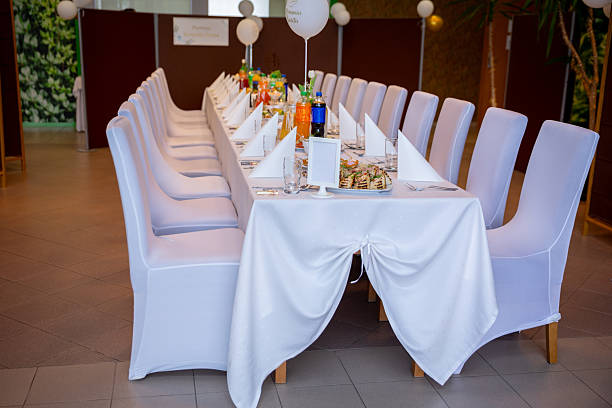 A beautifully arranged long dining table, elegantly prepared for a joyous celebration or festive gathering