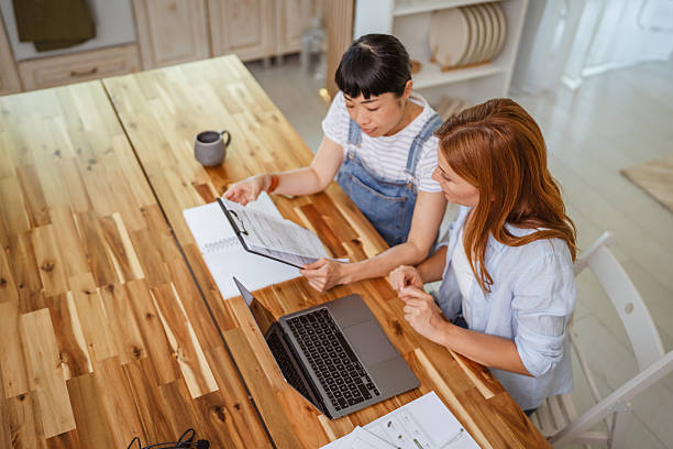 istock stressed female colleagues while collaboration on a project at home 2224011023